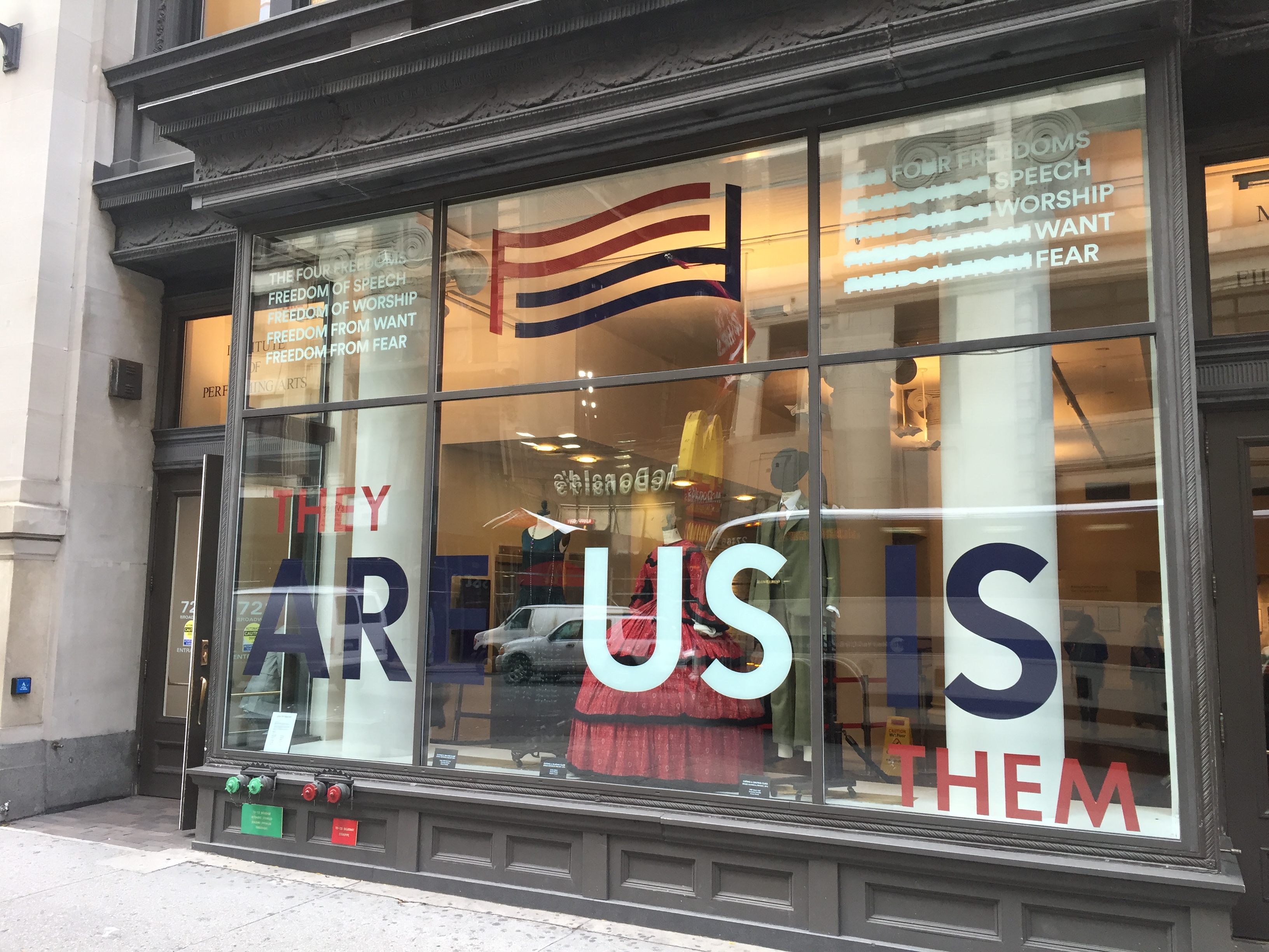 Street view of the 721 Broadway windows showing For Freedoms installation